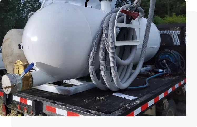 Technician inspecting a septic riser during a residential service visit